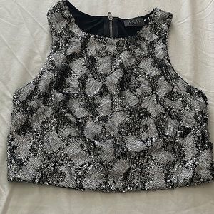 Black and sliver crop top. Material is soft in the inside.